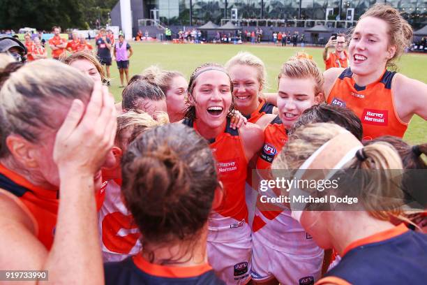 Giants players celebrate the win during the round three AFLW match between the Collingwood Magpies and the Greater Western Sydney Giants at Olympic...