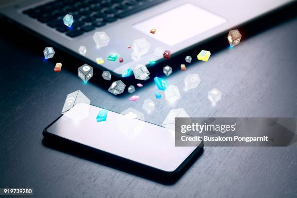 close up of business and smartphone with cloud of colorful application icons, business software and social media networking service concept - app stockfoto's en -beelden