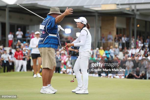 Jin Young Ko of South Korea celebrates with her caddie after winning the Women's Australian Open on the 18th green during day four of the ISPS Handa...