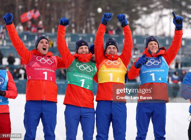 Gold medalists Didrik Toenseth, Martin Johnsrud Sundby, Simen Hegstad Krueger and Johannes Hoesflot Klaebo of Norway celebrate during the victory...