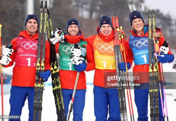 Gold medalists Didrik Toenseth, Martin Johnsrud Sundby, Simen Hegstad Krueger and Johannes Hoesflot Klaebo of Norway celebrate during the victory...