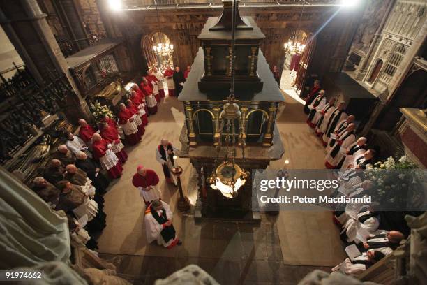 Catholic and Anglican clergy encircle the Shrine of St Edward the Confessor as The Dean of Westminster, Reverend Dr John Hall leads The Archbishop of...