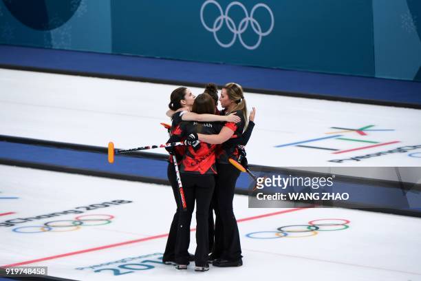 Canada's Rachel Homan celebrates with her teammates after winning the curling women's round robin session between Canada and Switzerland during the...