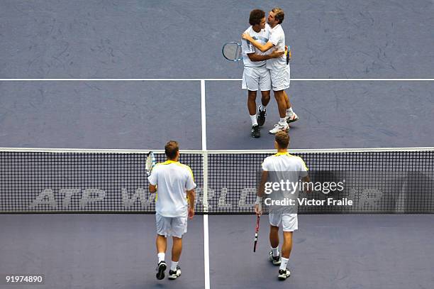 Jo-Wilfried Tsonga and Julien Benneteau of France celebrate match point to Mariusz Fyrstenberg and Marcin Matkowski of Poland on their doubles final...