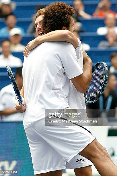 Jo-Wilfried Tsonga and Julien Benneteau of France celebrate match point against Mariusz Fyrstenberg and Marcin Matkowski of Poland during the doubles...