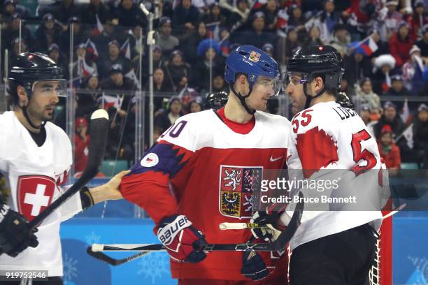 Roman Cervenka of the Czech Republic argues with Romain Loeffel of Switzerland during the Men's Ice Hockey Preliminary Round Group A game on day nine...