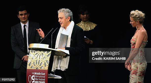 Palestinian director Elia Suleiman accepts the Black Pearl award for best Middle Eastern narrative film during the closing ceremony of the third...