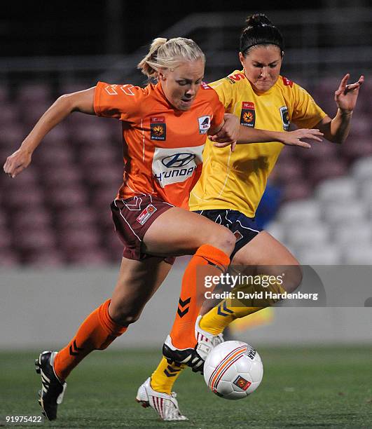 Tameka Butt of the Roar and Lydia Vandenbergh of the Mariners compete fot the ball during the round three W-League match between the Brisbane Roar...