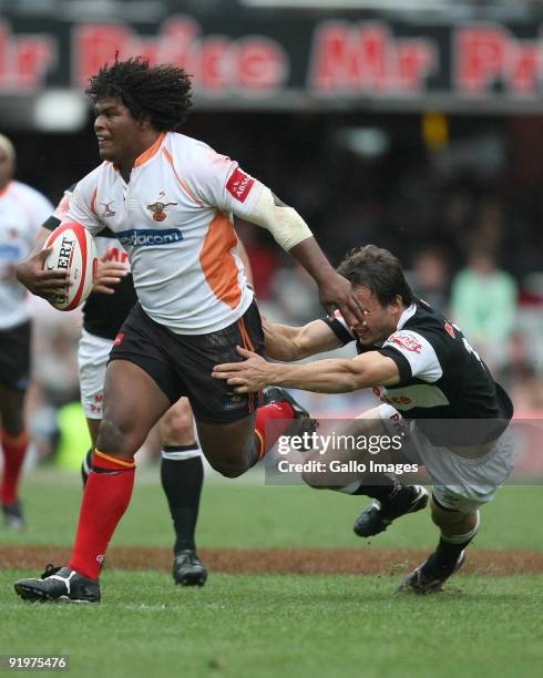 Ashley Johnson of Cheetahs hands off Juan Hernandez of Sharks during the Absa Currie Cup semi final match between the Sharks and Cheetahs from Absa...