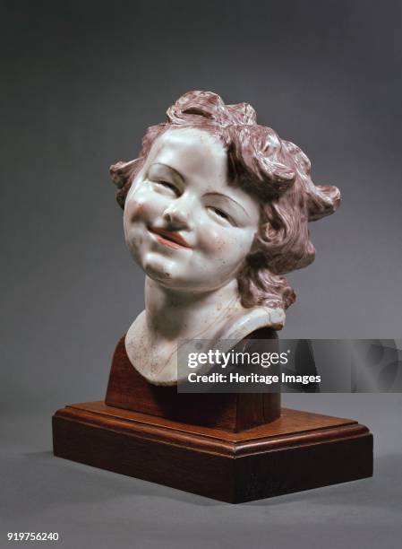 Head of laughing child, circa 1752. Head tilted to the left, grey brown curly hair, pink half smiling lips, and narrowed eyes. Artist Louis Francois...