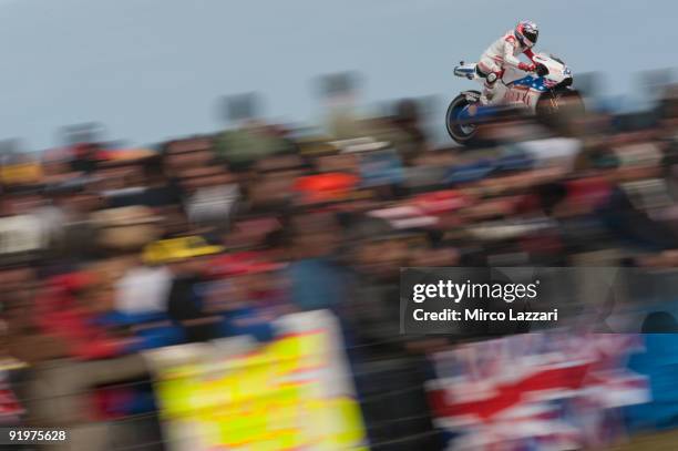 Casey Stoner of Australia and Ducati Marlboro Team heads down a straight during the MotoGP race of the Australian MotoGP, which is round 15 of the...