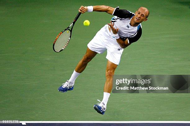 Nikolay Davydenko of Russia serves to Rafael Nadal of Spain during the final on day eight of the 2009 Shanghai ATP Masters 1000 at Qi Zhong Tennis...