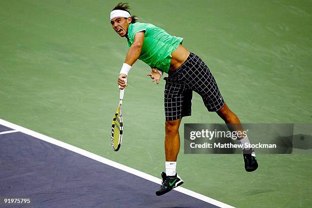 Rafael Nadal of Spain serves to Nikolay Davydenko of Russia during the final on day eight of the 2009 Shanghai ATP Masters 1000 at Qi Zhong Tennis...