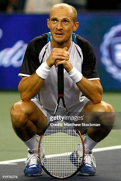 Nikolay Davydenko of Russia watches the instant replay board for determination of match point against Rafael Nadal of Spain after their match during...