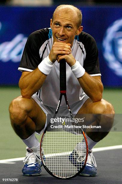 Nikolay Davydenko of Russia watches the instant replay board for determination of match point against Rafael Nadal of Spain after their match during...