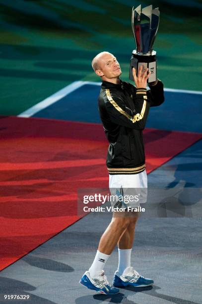 Nikolay Davydenko of Russia poses for photographers after defeating Rafael Nadal of Spain during the final on day eight of 2009 Shanghai ATP Masters...