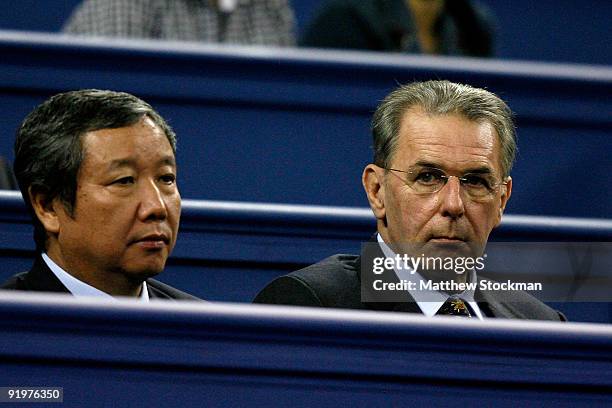 Vice President of China Administration of Sport Yu Zai Qing and IOC President Jacques Rogge watch Nikolay davydenko of Russia play Rafael Nadal of...