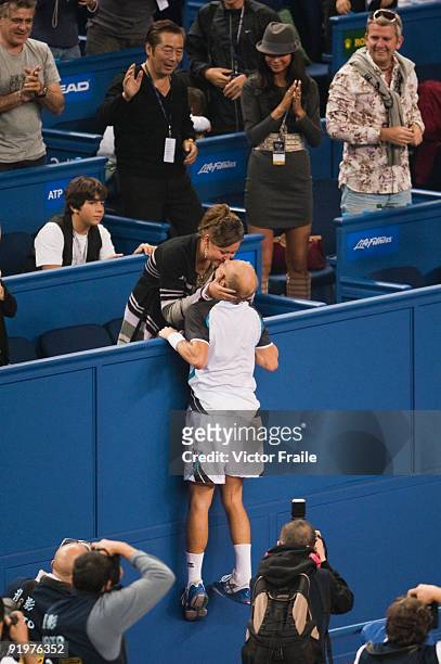 Nikolay Davydenko of Russia kisses his wife Irina Davydenko after defeating Rafael Nadal of Spain on the final during day eight of 2009 Shanghai ATP...
