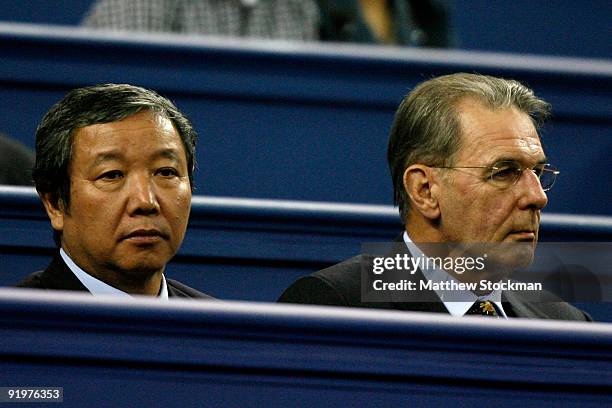 Vice President of China Administration of Sport Yu Zai Qing and IOC President Jacques Rogge watch Nikolay davydenko of Russia play Rafael Nadal of...