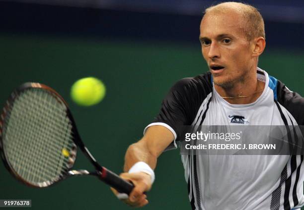 Nikolay Davydenko of Russia hits a forehand return against Rafael Nadal of Spain in the men's singles final at the ATP Shanghai Masters tennis...