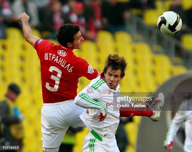 Martin Stranzl of FC Spartak Moscow battles for the ball with Dmitri Sychev of FC Lokomotiv Moscow during the Russian Football League Championship...