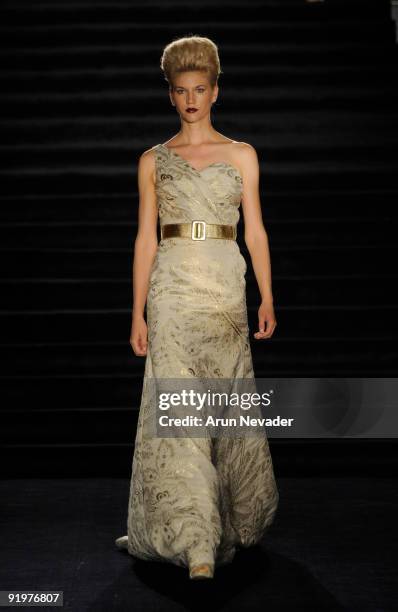 Model walks the runway wearing Kevan Hall during a Kevan Hall fashion show at Universal Studios Hollywood on October 17, 2009 in Universal City,...