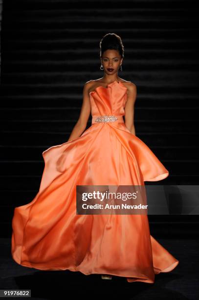 Model walks the runway wearing Kevan Hall during a Kevan Hall fashion show at Universal Studios Hollywood on October 17, 2009 in Universal City,...