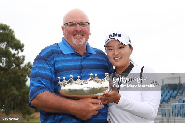 Jin Young Ko of South Korea and her caddie Dean Herden pose with the trophy after winning the Women's Australian Open during day four of the ISPS...