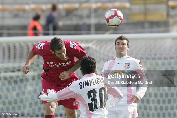 Cristiano Lucarelli of AS Livorno Calcio in action against Fabio Eriquez Simplicio of US CItta' di Palermo during the Serie A match between AS...