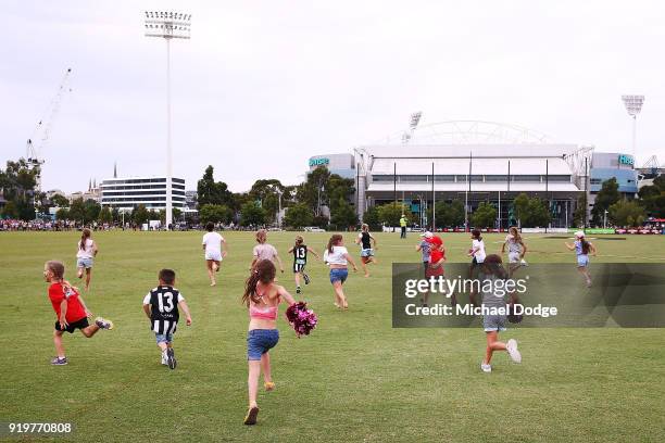 Young fans run out to the ground after the round three AFLW match between the Collingwood Magpies and the Greater Western Sydney Giants at Olympic...