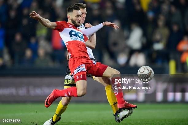 Idir Ouali forward of KV Kortrijk is fighting for the ball with Gil Van Moerzeke defender of Sporting Lokeren during the Jupiler Pro League match...