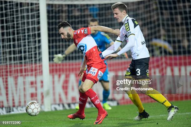 Idir Ouali forward of KV Kortrijk is challenged by Gil Van Moerzeke defender of Sporting Lokeren during the Jupiler Pro League match between Sporting...