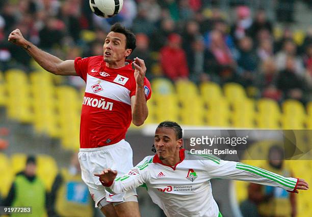Martin Stranzl of FC Spartak Moscow battles for the ball with Peter Odemwingie of FC Lokomotiv Moscow during the Russian Football League Championship...