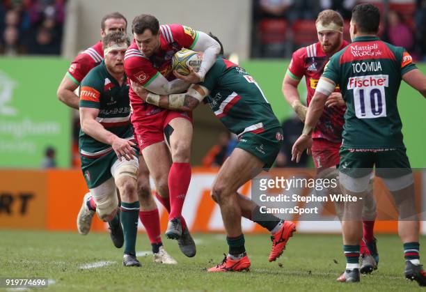 Harlequins' Tim Visser is tackled by Leicester Tigers' Adam Thompstone during the Aviva Premiership match between Leicester Tigers and Harlequins at...