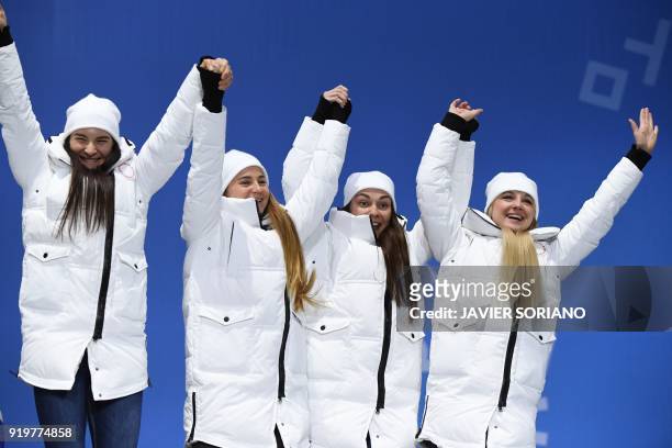 Russia's bronze medallists Natalia Nepryaeva, Yulia Belorukova, Anastasia Sedova and Anna Nechaevskaya pose on the podium during the medal ceremony...