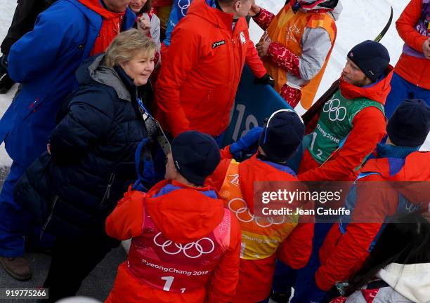 Prime Minister of Norway Erna Solberg congratulates gold medalists of Team Norway Didrik Toenseth, Martin Johnsrud Sundby, Simen Hegstad Krueger,...