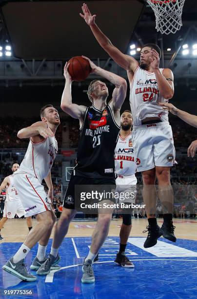 David Barlow of Melbourne United and Cody Ellis of the Hawks compete for the ball during the round 19 NBL match between Melbourne United and the...