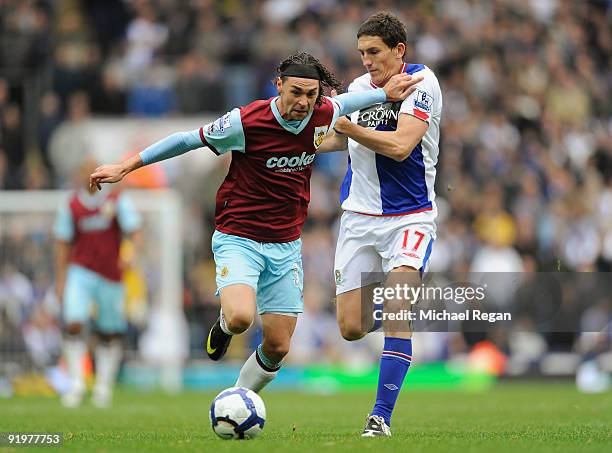 Chris Eagles of Burnley is challenged by Keith Andrews of Blackburn during the Barclays Premier League match between Blackburn Rovers and Burnley at...