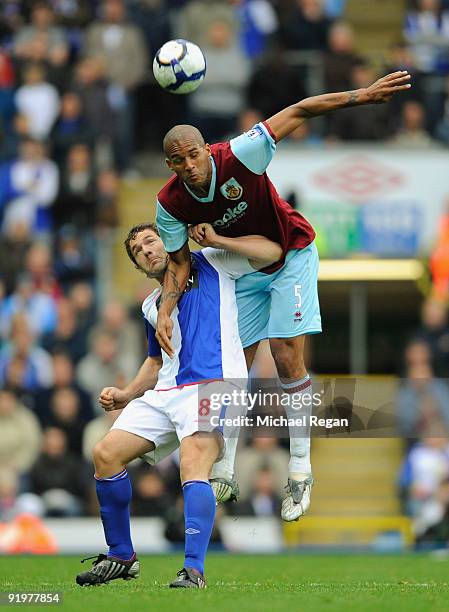 David Dunn of Blackburn is challenged by Clarke Carlisle of Burnley during the Barclays Premier League match between Blackburn Rovers and Burnley at...