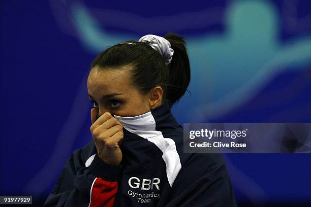 Beth Tweddle of Great Britain reacts while she waits for the results during the floor exercise event during the Apparatus Finals on the sixth day of...