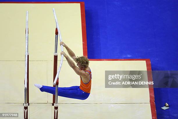 Holland's Epke Zonderland performs in the parallel bars event in the apparatus finals during the Artistic Gymnastics World Championships 2009 at the...