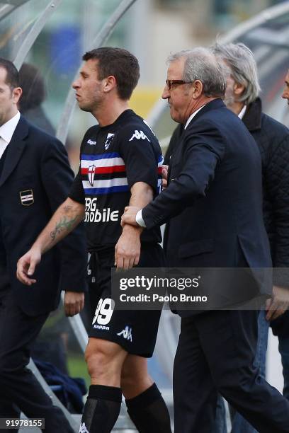 Head coach Luigi Del Neri of Sampdoria assists Antonio Cassano from the field of play after the Serie A match between SS Lazio and UC Sampdoria at...