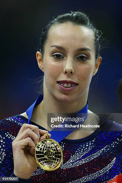 Beth Tweddle of Great Britain celebrates with her gold medal after she won the floor exercise during the Apparatus Finals on the sixth day of the...