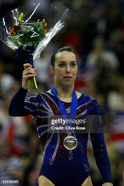 Beth Tweddle of Great Britain celebrates with her gold medal after she won the floor exercise during the Apparatus Finals on the sixth day of the...