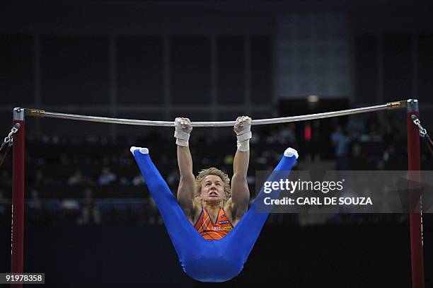 Holland's Epke Zonderland performs in the high bar event in the apparatus finals during the Artistic Gymnastics World Championships 2009 at the 02...