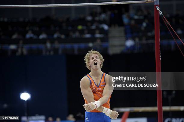 Holland's Epke Zonderland celebrates after performing in the high bar event in the apparatus finals during the Artistic Gymnastics World...