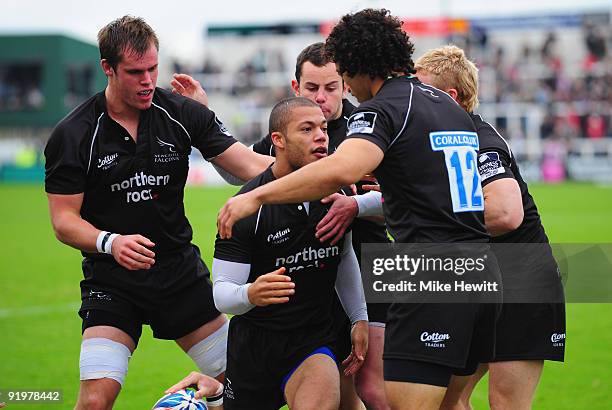 Man of the match Danny Williams is congratulated by team mates after scoring the opening try during the Amlin Challenge Cup match between Newcastle...