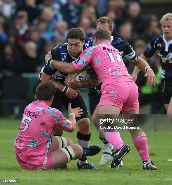 Matt Banahan of Bath is tackled by Pascal Pape and Benjamin Kayser during the Heineken Cup match between Bath and Stade Francais at the Recreation...