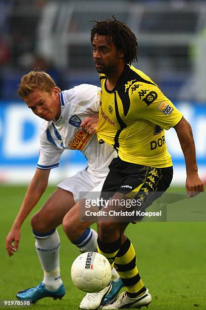 Dennis Grote of Bochum battles for the ball with Patrick Owomoyela of Dortmund during the Bundesliga match between Borussia Dortmund and VfL Bochum...