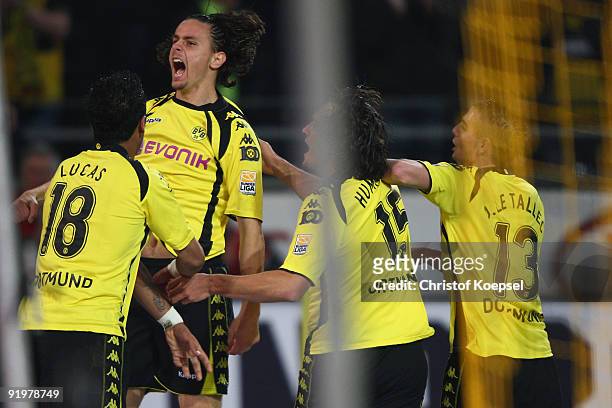 Neven Subotic of Dortmund celebrates his team's second goal with team mates Lucas Barrios, Nelson Valdez and Damien Le Tallec during the Bundesliga...
